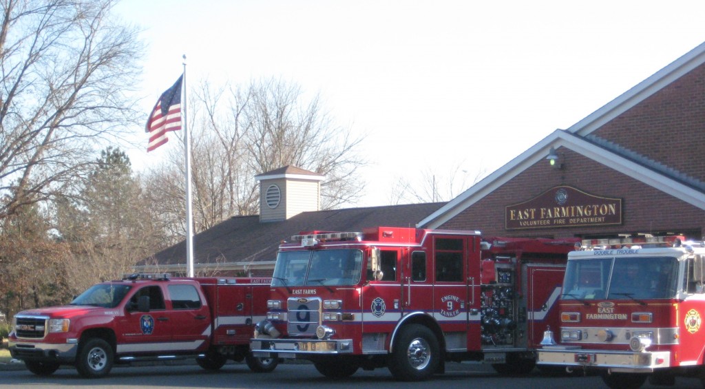 Medic 11, Engine 9 and Engine 10 in front of the East Farmington Fire Station.